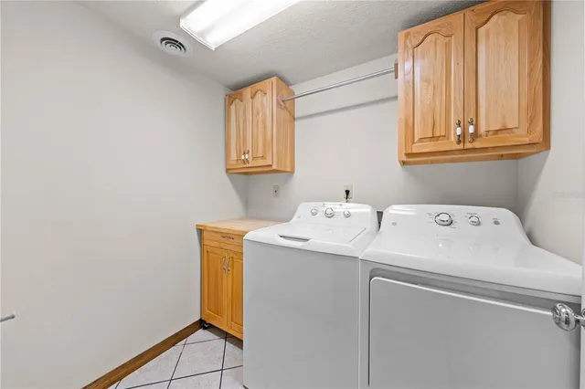 a view of an empty room with a fireplace and a floor to ceiling window