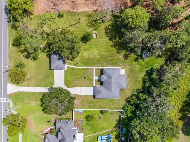 an aerial view of a house with a garden