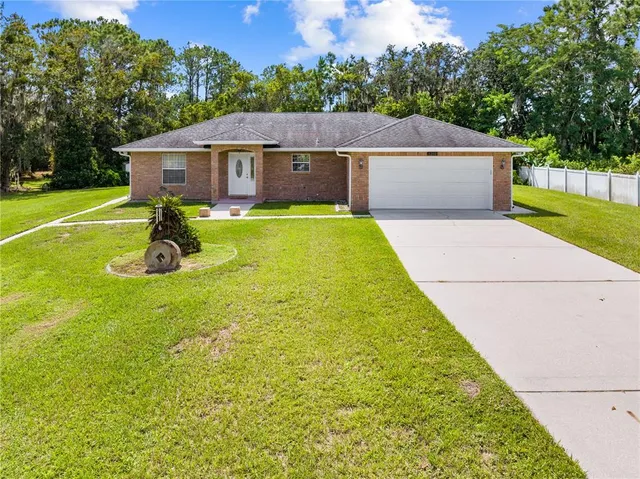 a aerial view of a house with swimming pool