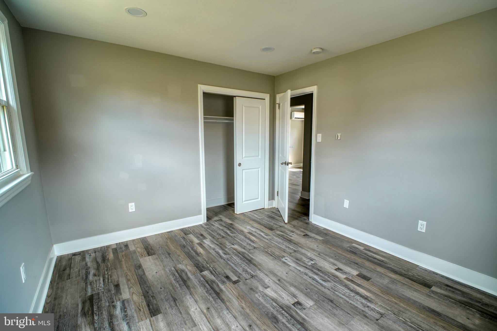 3220 Byberry Road Philadelphia, PA 19154 - Photo 12 of 31 a view of an empty room with wooden floor and a window