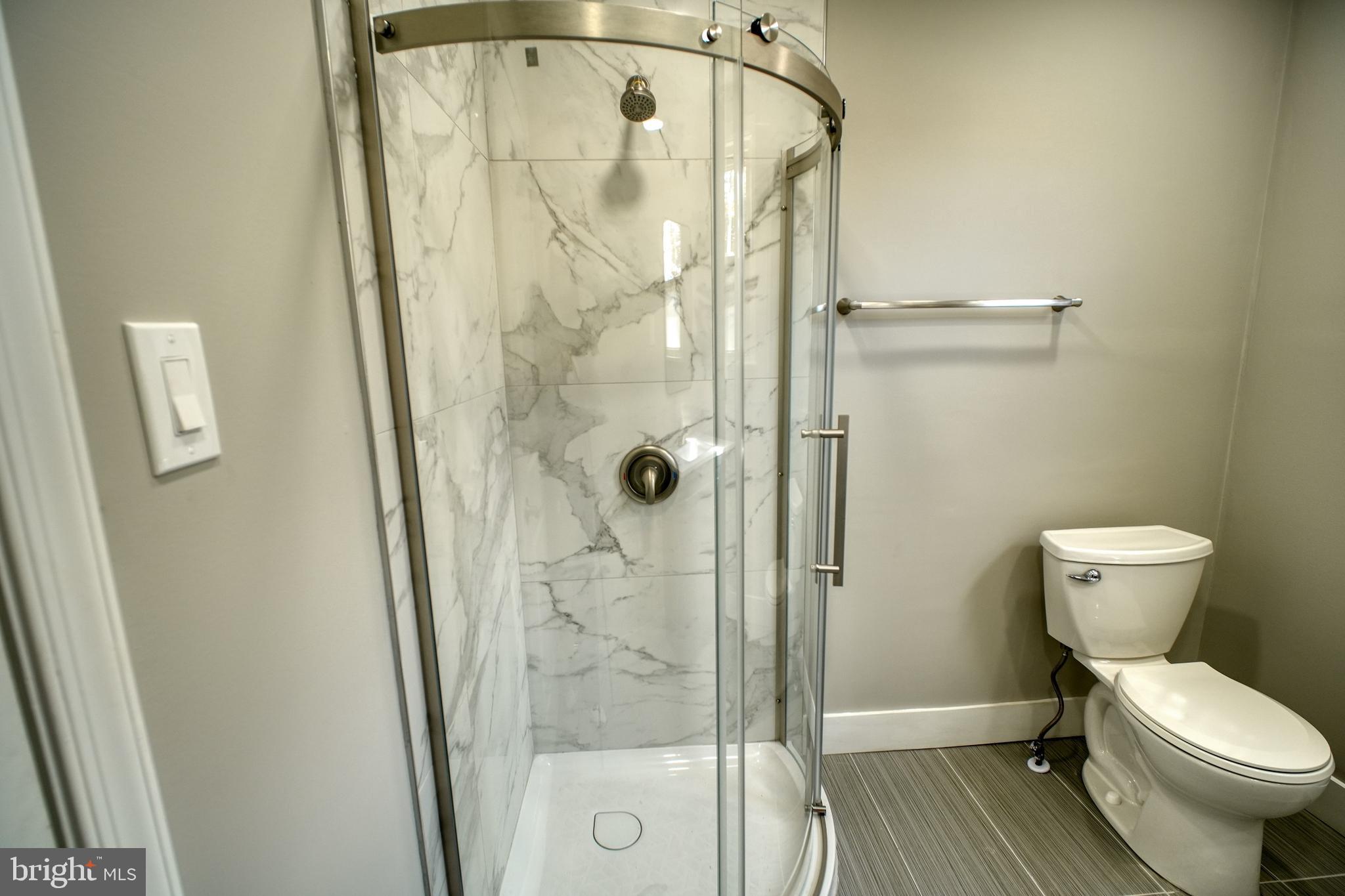 3220 Byberry Road Philadelphia, PA 19154 - Photo 16 of 31 a bathroom with a toilet and a shower