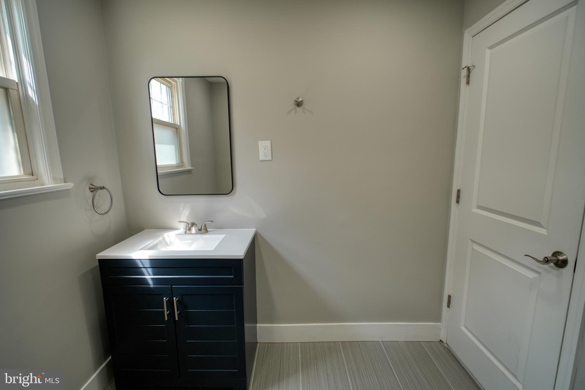 3220 Byberry Road Philadelphia, PA 19154 - Photo 17 of 31 a bathroom with a sink and a mirror