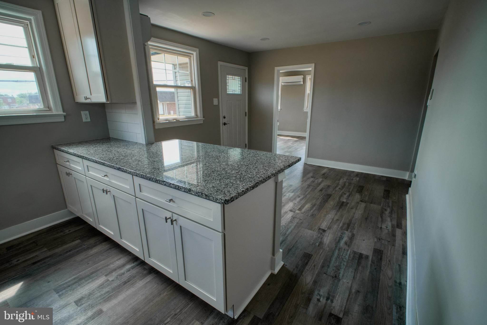 3220 Byberry Road Philadelphia, PA 19154 - Photo 8 of 31 a kitchen with granite countertop cabinets appliances and a window