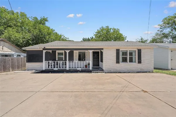 a front view of a house with yard