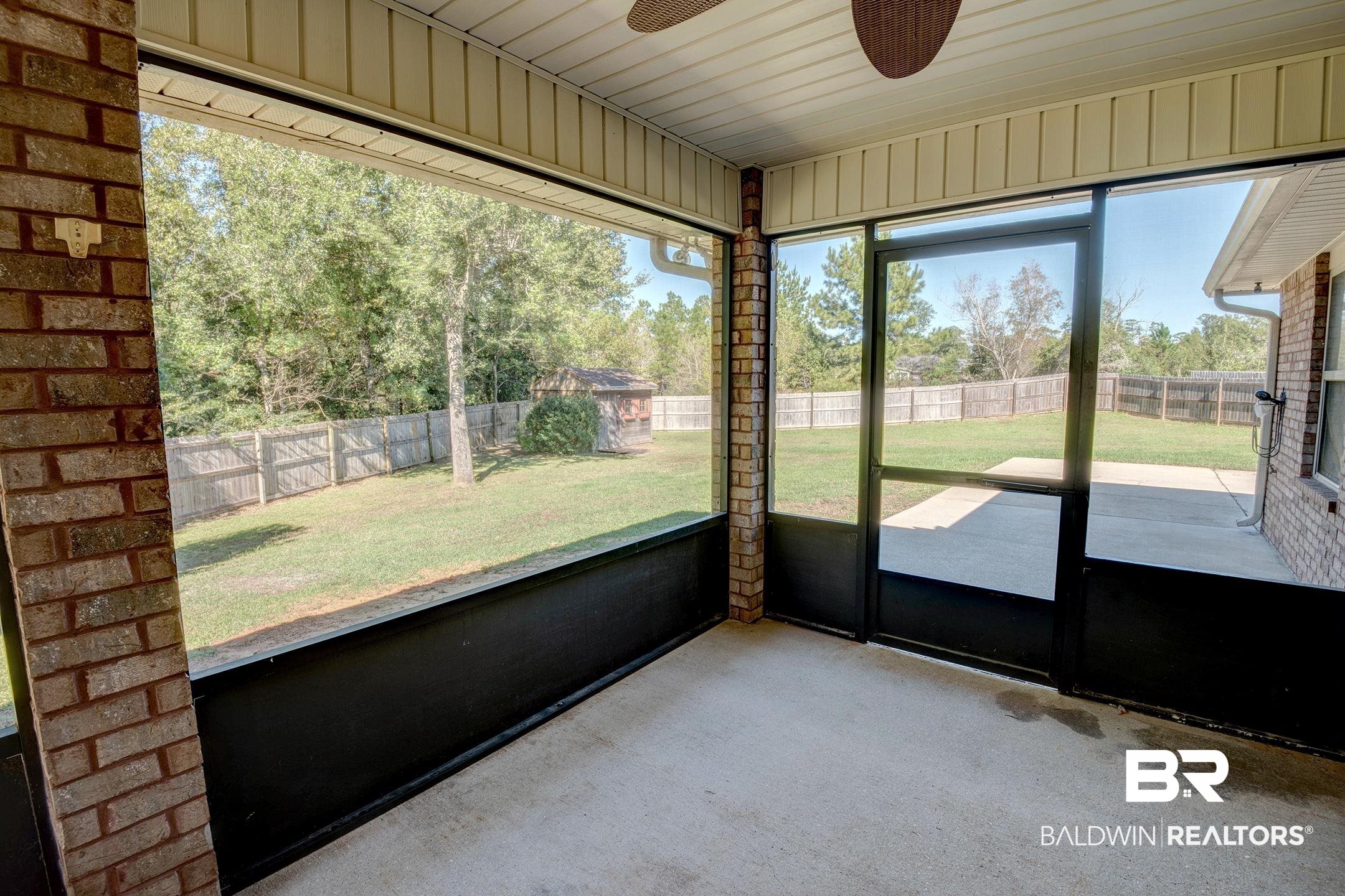15345 Fremont Court Foley, AL 36535 - Photo 30 of 35 Unfurnished sunroom with ceiling fan and a healthy amount of sunlight