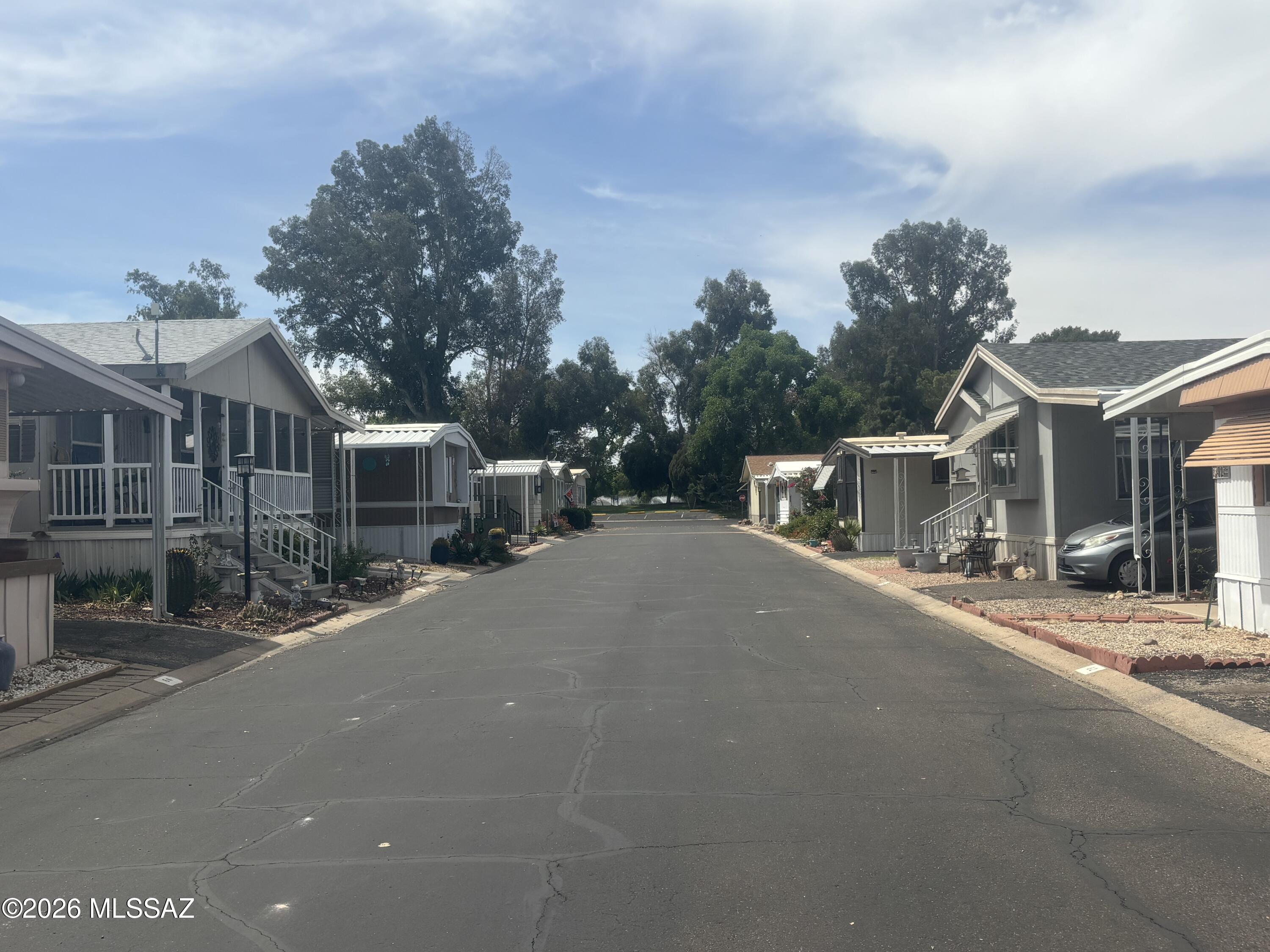 4550 North Flowing Wells Road, Unit 65 Tucson, AZ 85705 - Photo 8 of 50 a view of a street with houses