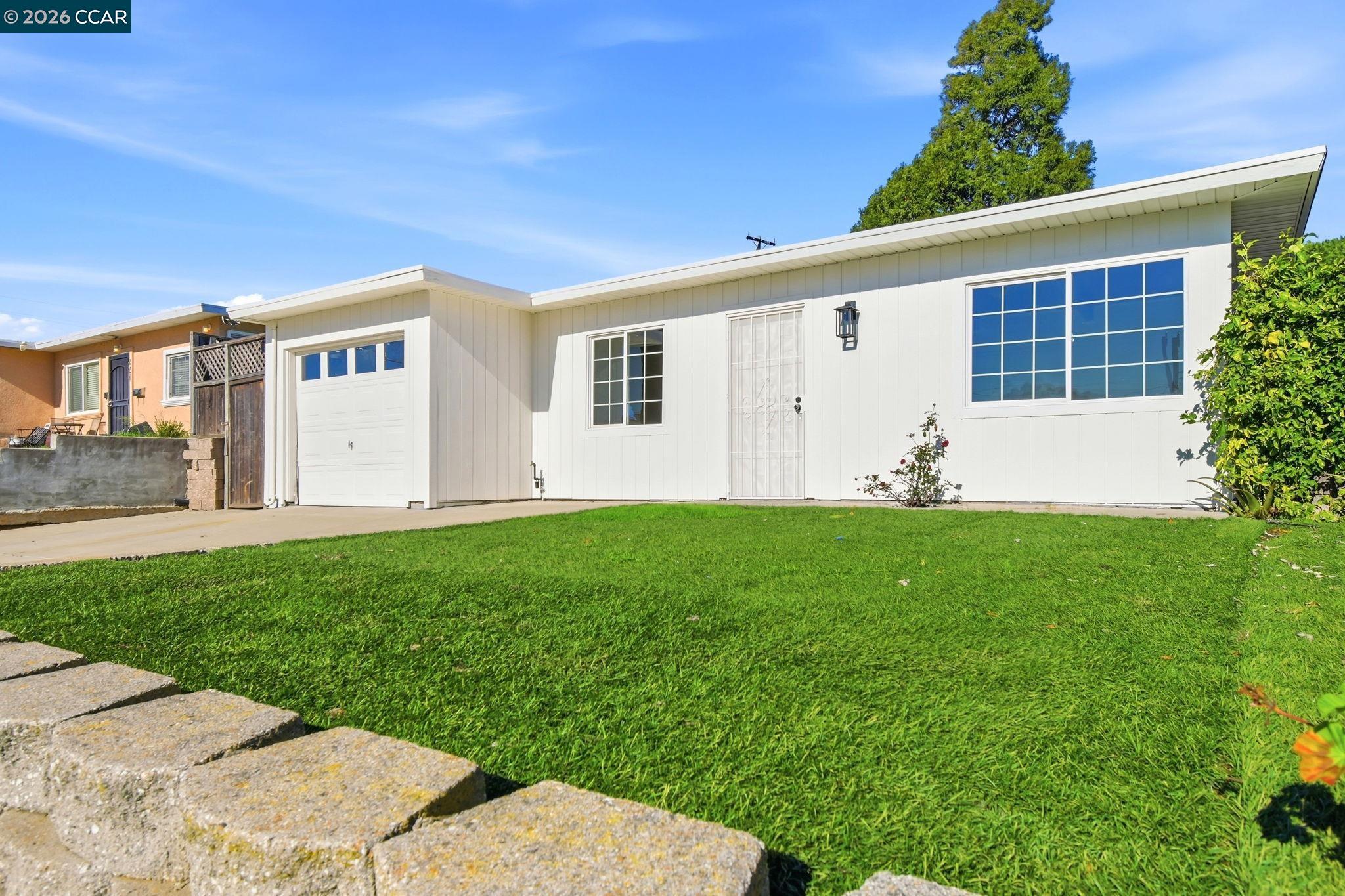 426 La Jolla Street Vallejo, CA 94591 - Photo 1 of 20 a front view of a house with a yard and garage