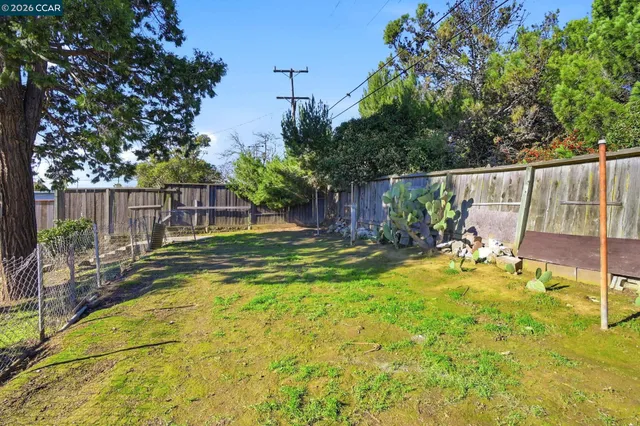 a view of a backyard with swimming pool
