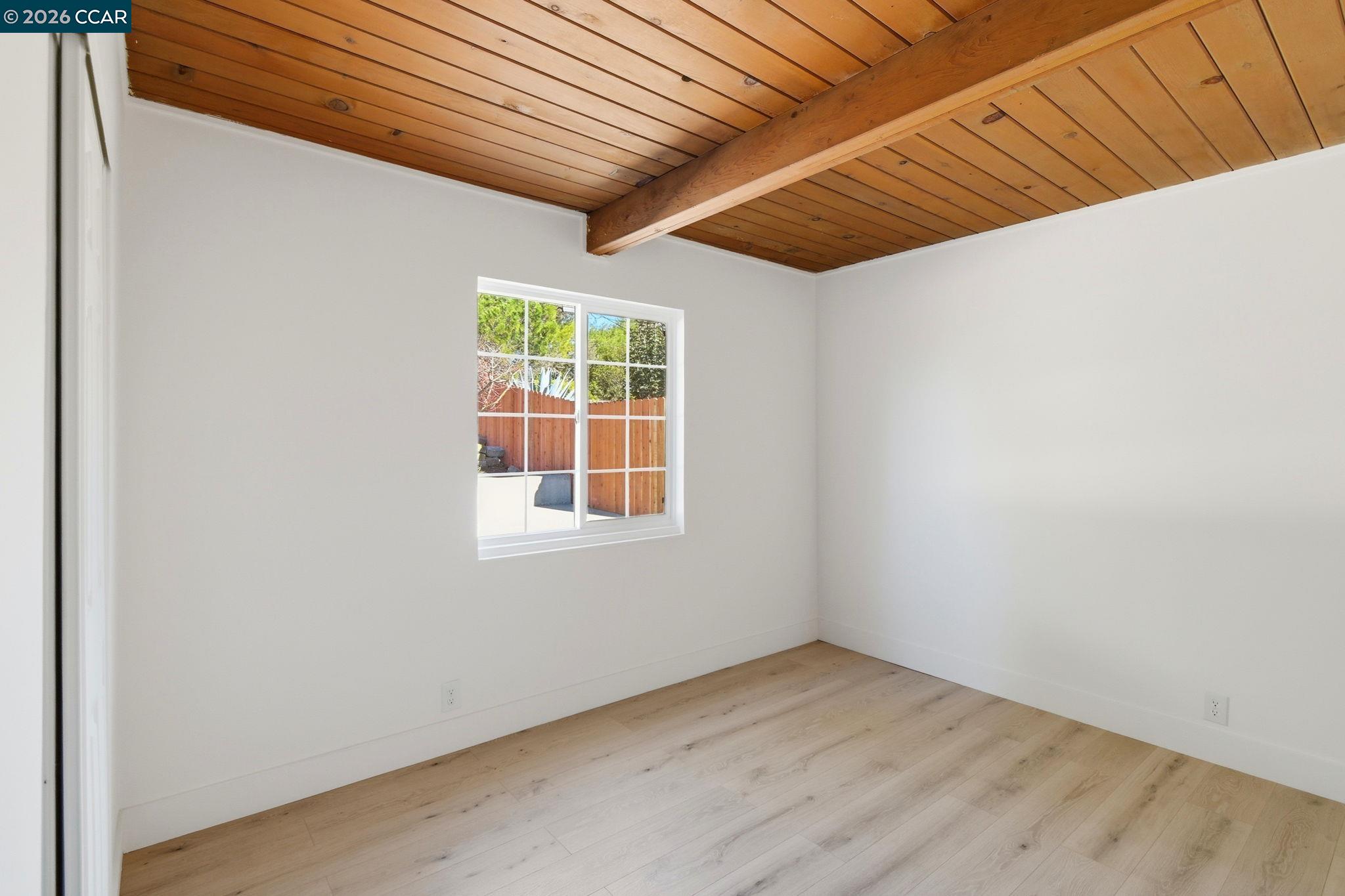 426 La Jolla Street Vallejo, CA 94591 - Photo 7 of 20 an empty room with wooden floor and windows