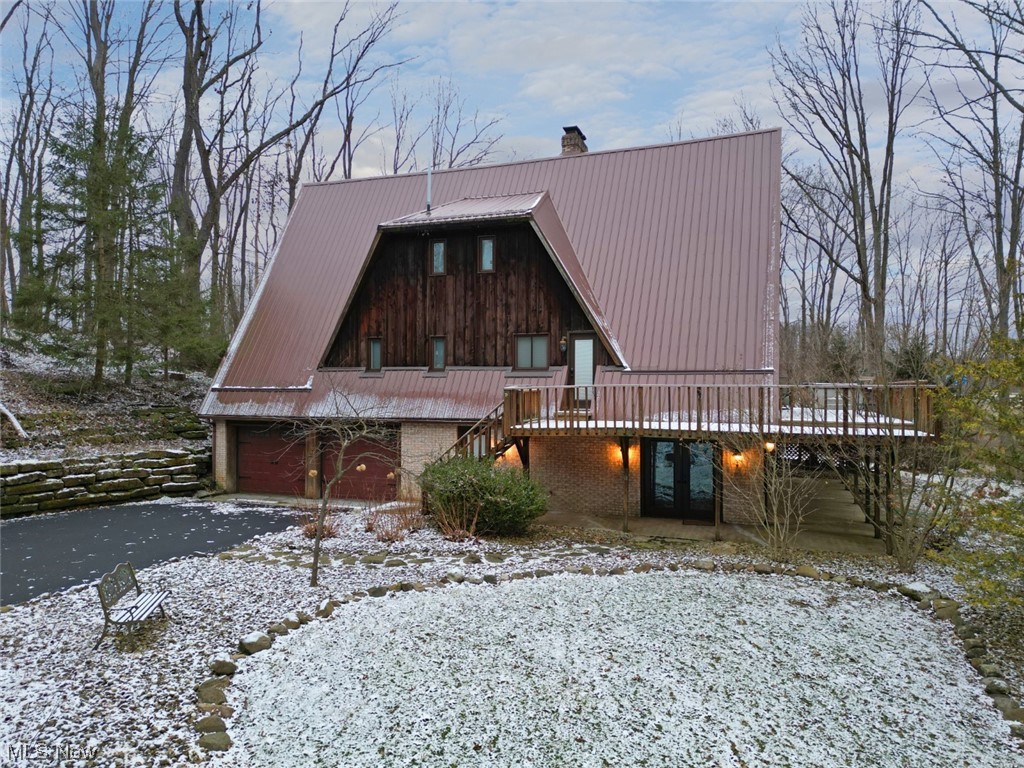 7550 South Raccoon Road Canfield, OH 44406 - Photo 2 of 32 View of front of property featuring a garage and a wooden deck