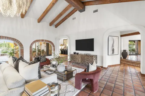 a view of a living room with entryway