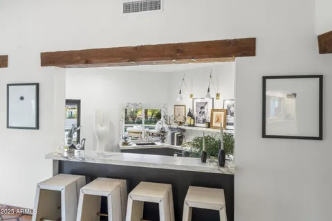 a kitchen with stainless steel appliances granite countertop a stove and a sink