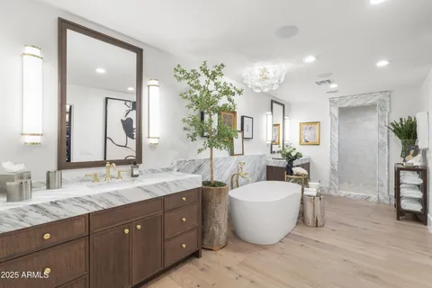 a bedroom with a bed and glass wall