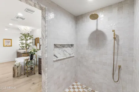 a kitchen with stainless steel appliances granite countertop a refrigerator and a stove top oven