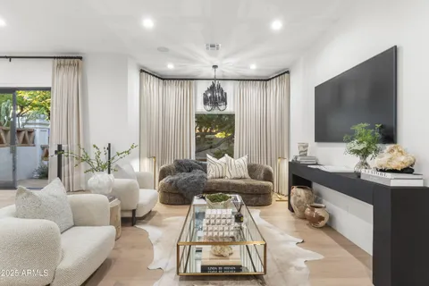 a front view of a house with garden and outdoor seating