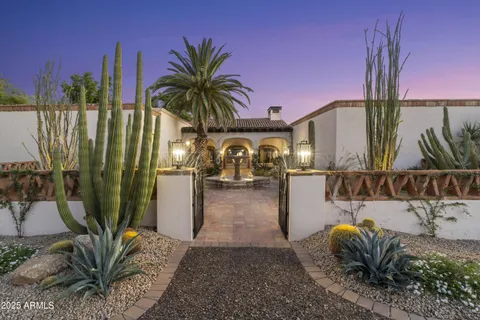 a living room with fireplace furniture and a large window