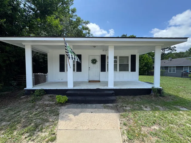a view of a house with garden