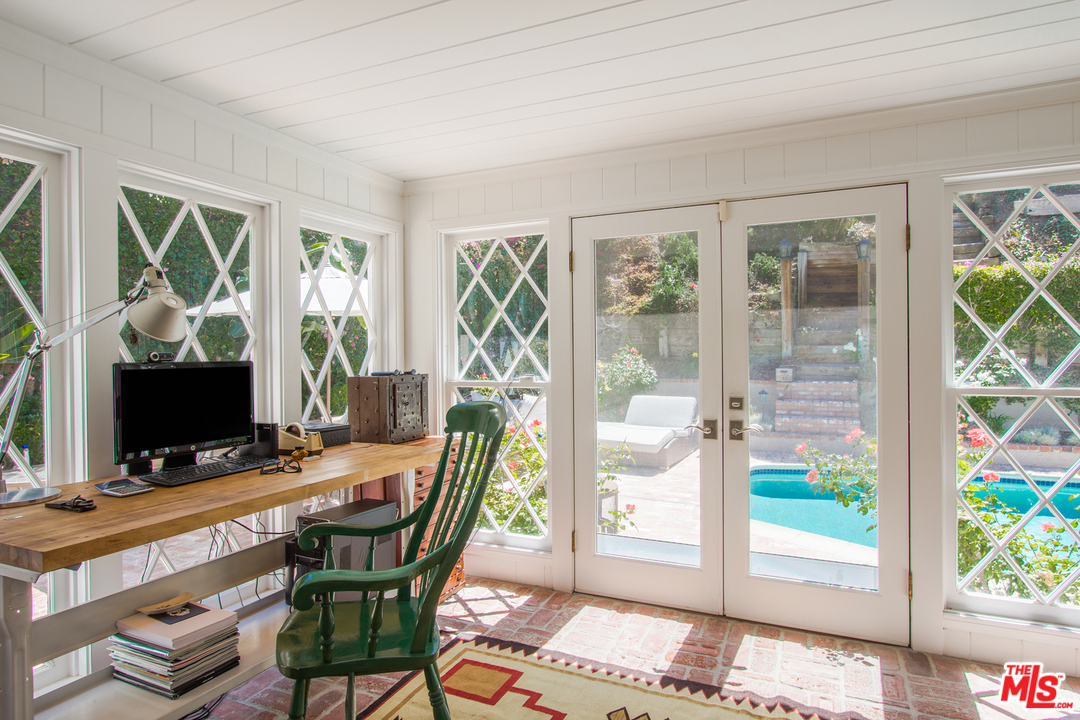 1538 Roscomare Road Los Angeles, CA 90077 - Photo 11 of 26 a view of a workspace with furniture and a window
