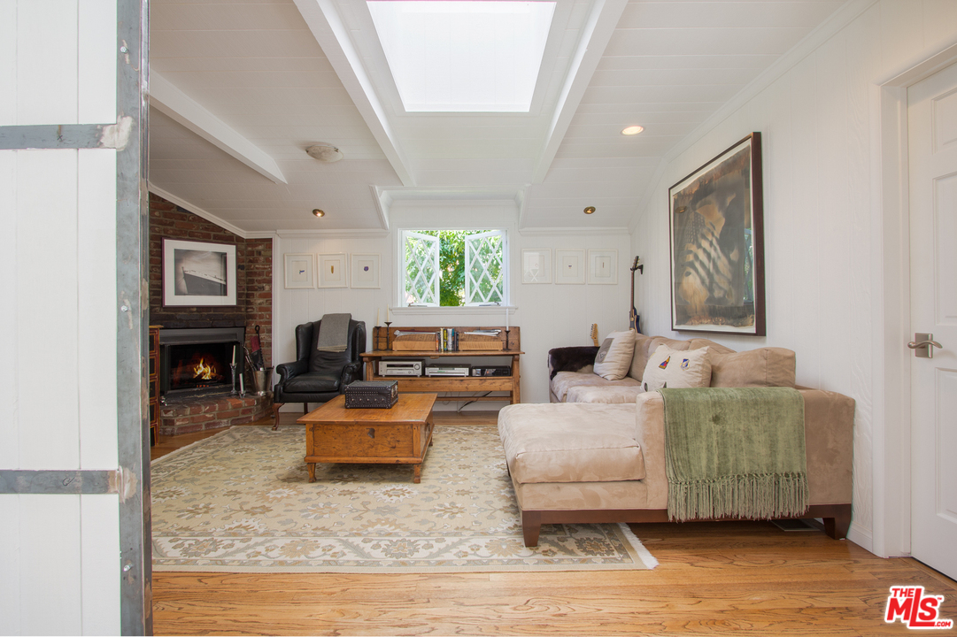 1538 Roscomare Road Los Angeles, CA 90077 - Photo 12 of 26 a living room with furniture and a fireplace