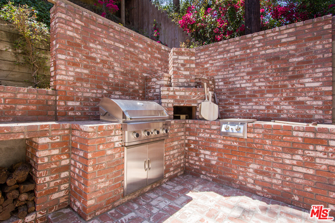 1538 Roscomare Road Los Angeles, CA 90077 - Photo 22 of 26 a picture of a door and with an outdoor space