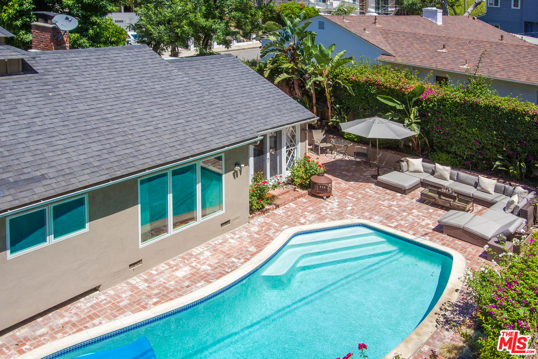 1538 Roscomare Road Los Angeles, CA 90077 - Photo 23 of 26 an aerial view of a house with swimming pool and patio