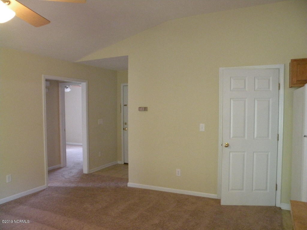 152 Oakley Drive New Bern, NC 28560 - Photo 23 of 40 Living room to front room and front door