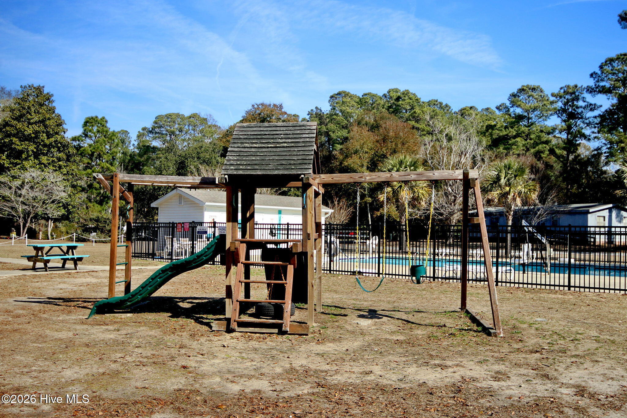 9157 Riveredge Place Southwest Calabash, NC 28467 - Photo 23 of 34 Playground equipment in the common area!