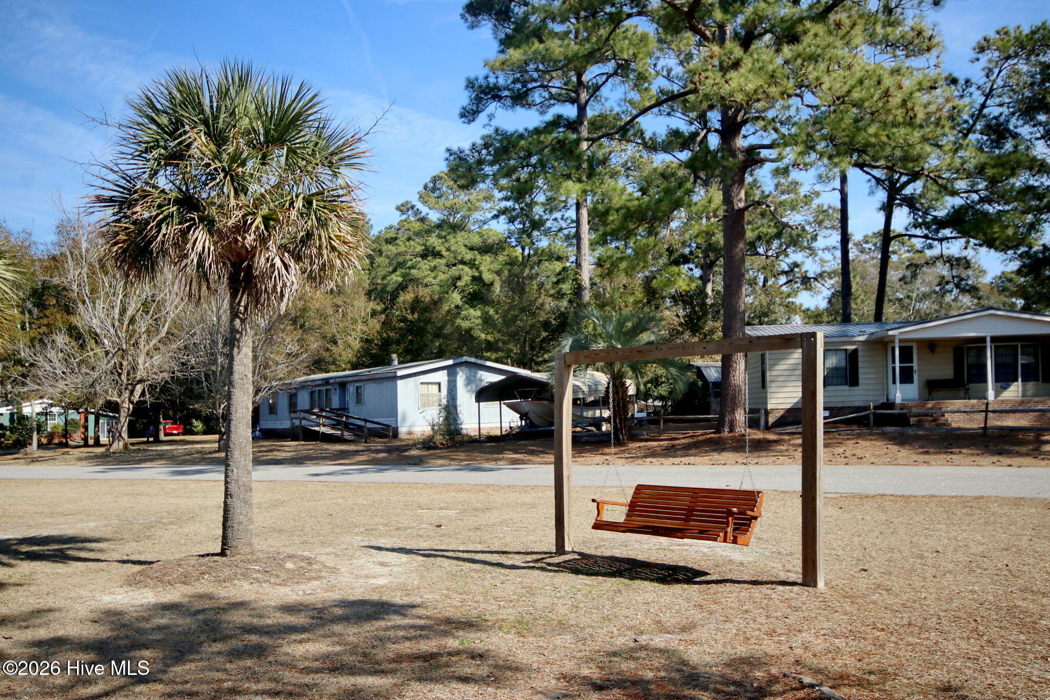 9157 Riveredge Place Southwest Calabash, NC 28467 - Photo 26 of 34 Relax on the neighborhood swing!