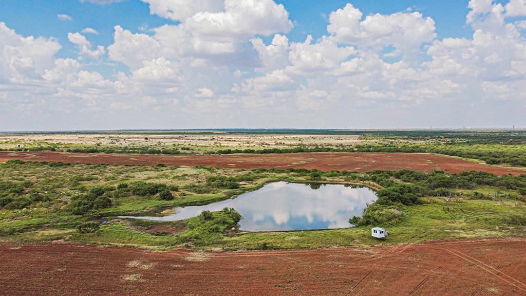 25 State Highway 25 Electra, TX 76360 - Photo 14 of 25 a view of a lake with houses in the back