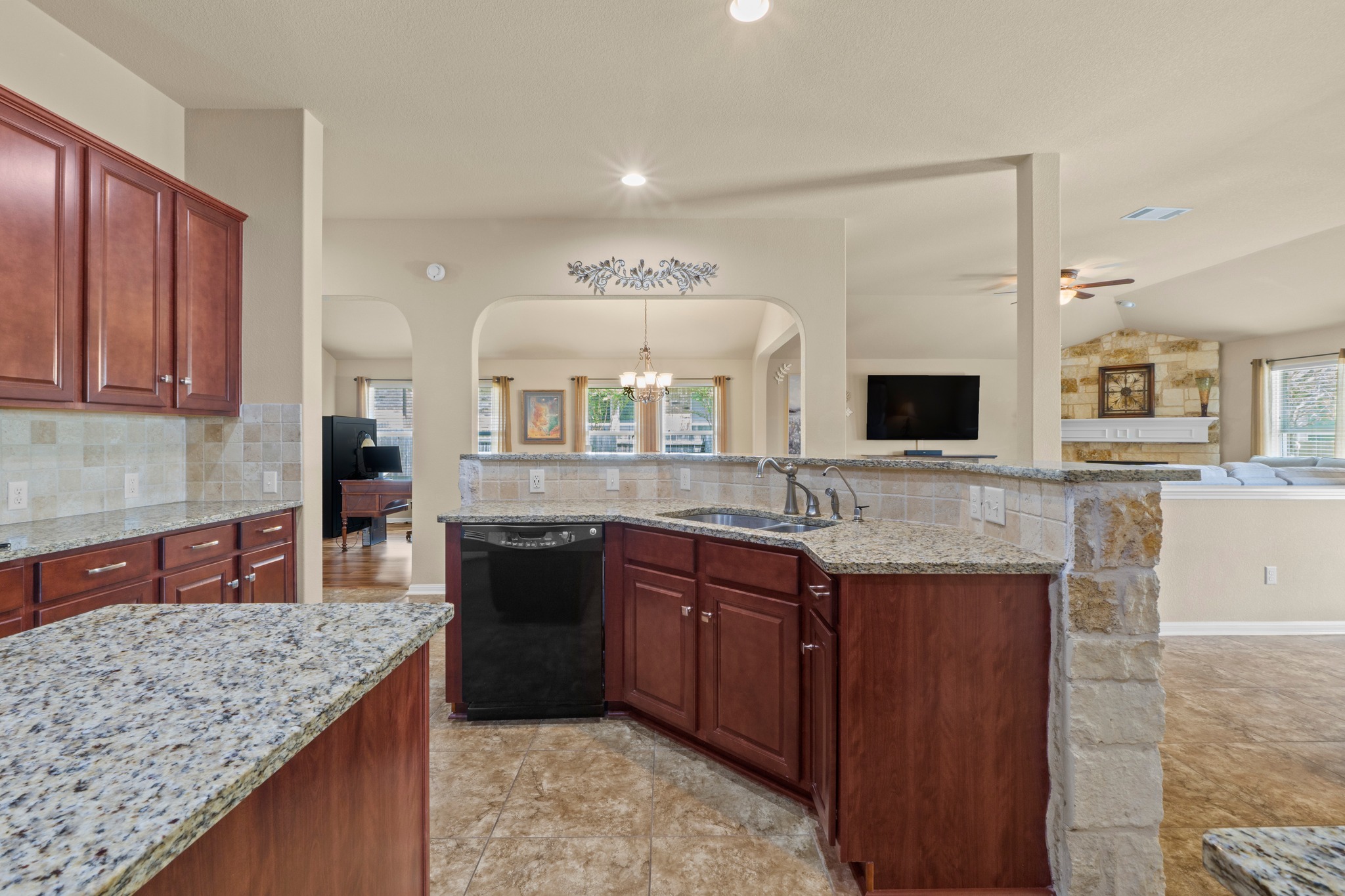 20525 Jackies Ranch Boulevard Pflugerville, TX 78660 - Photo 27 of 27 Kitchen featuring open floor plan, recessed lighting, sturdy granite countertops, and tasteful backsplash