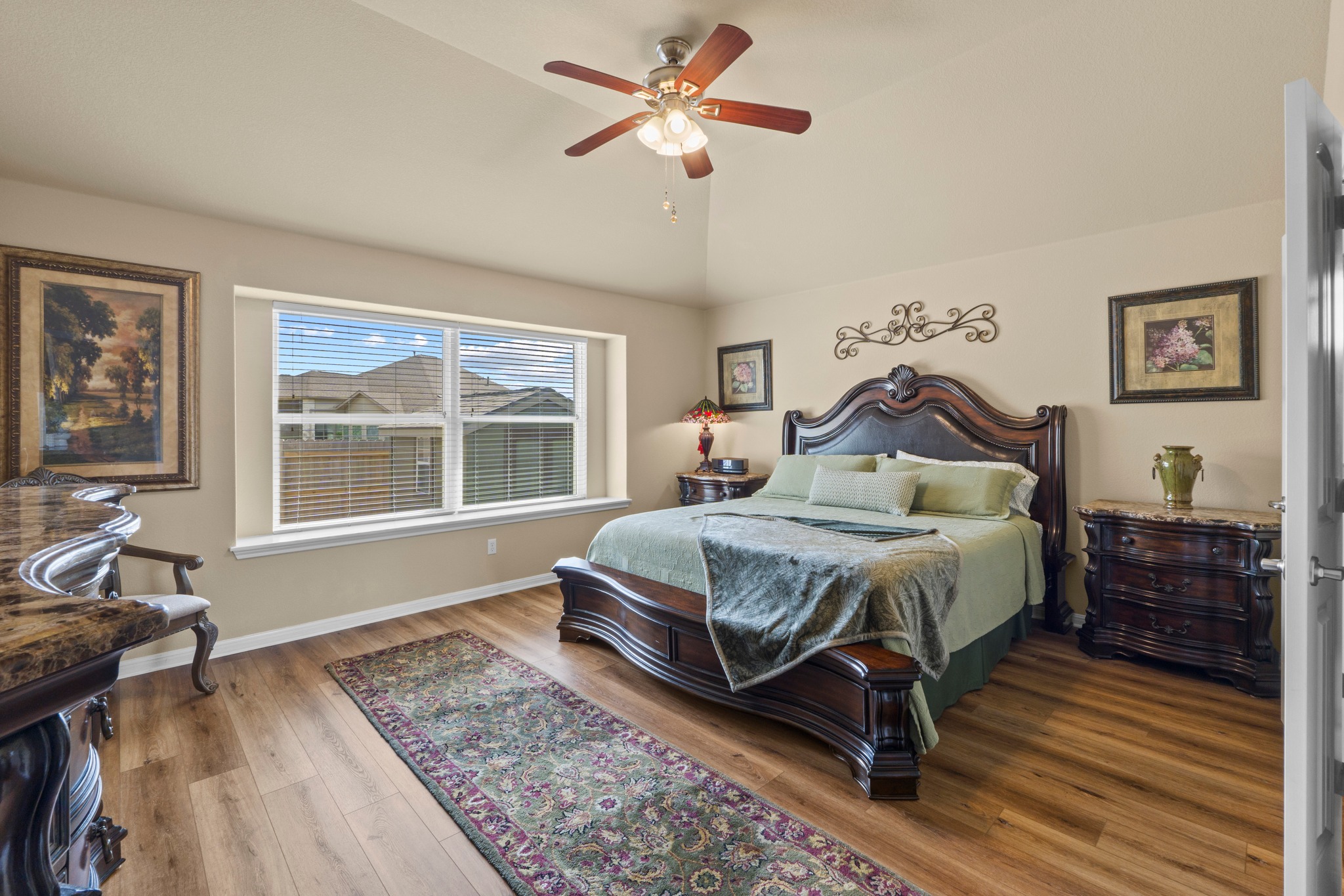 20525 Jackies Ranch Boulevard Pflugerville, TX 78660 - Photo 13 of 27 Bedroom featuring light wood-style floors, ceiling fan, and lofted ceiling