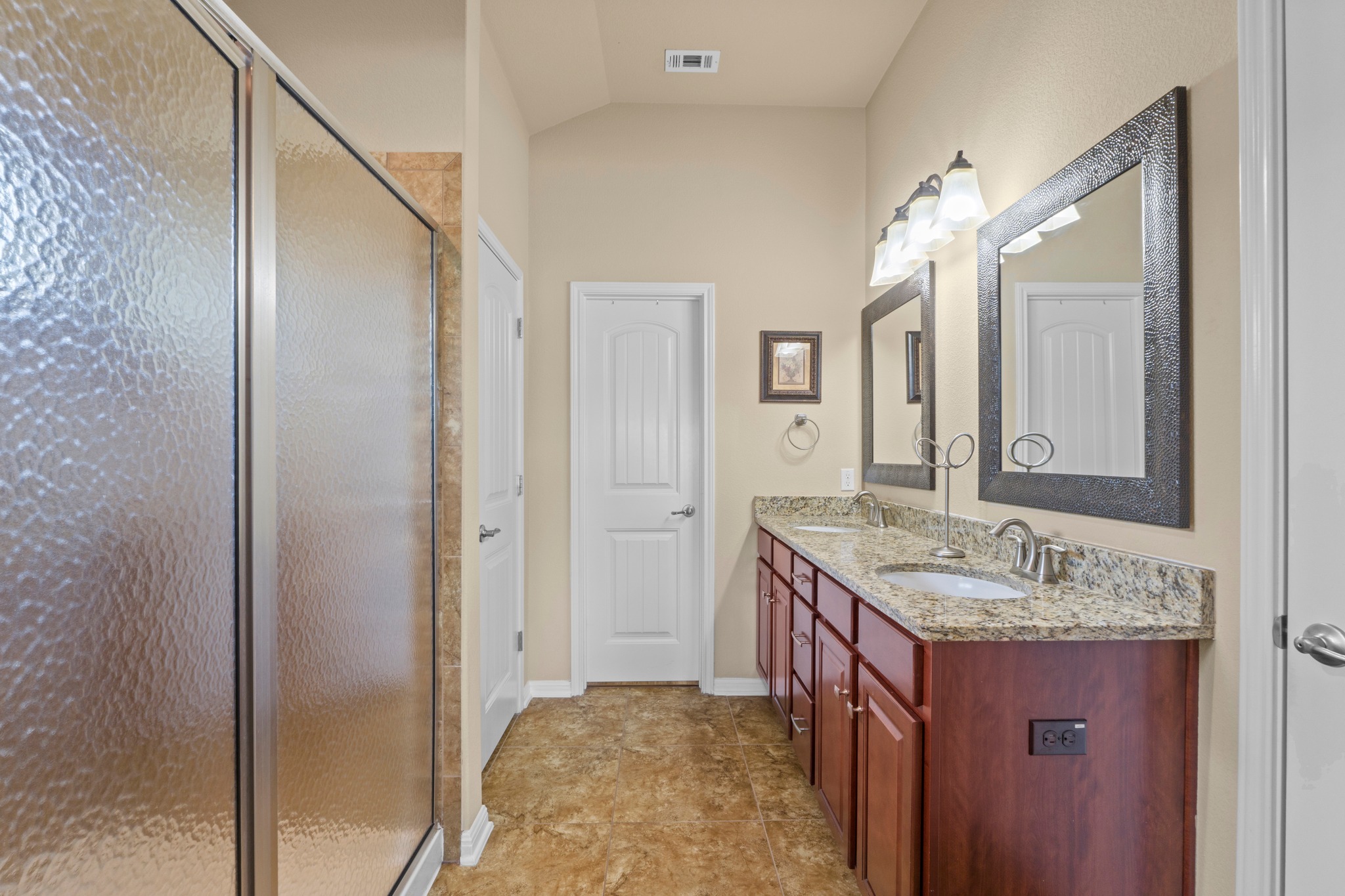 20525 Jackies Ranch Boulevard Pflugerville, TX 78660 - Photo 14 of 27 Full bathroom with double vanity and oversized shower with upper window for light. Walk in closet, storage, and separate room for toilet.