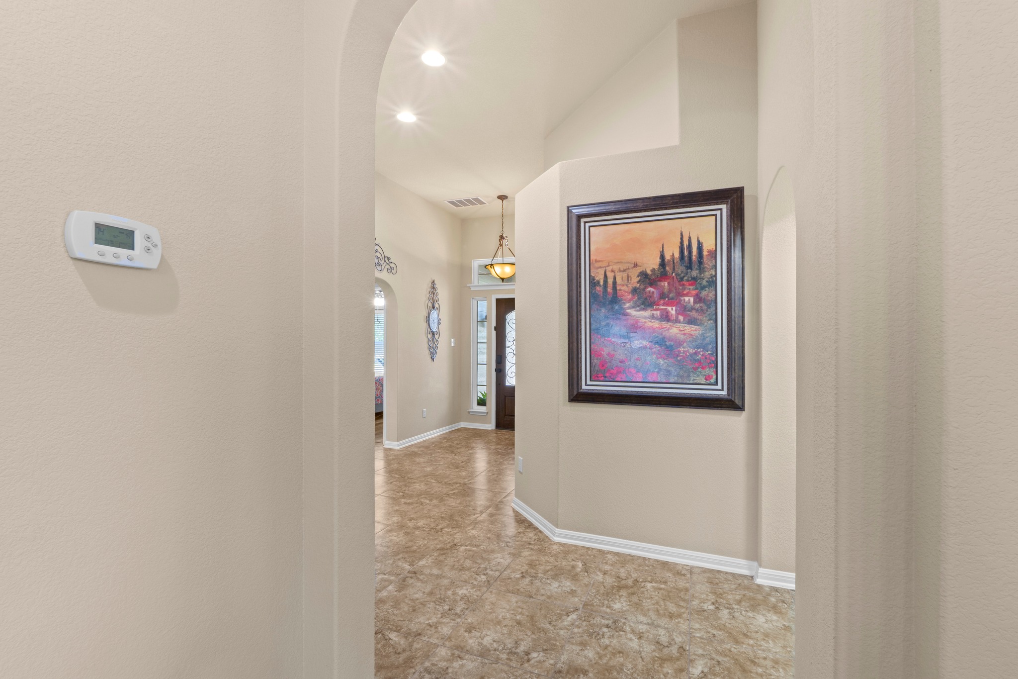 20525 Jackies Ranch Boulevard Pflugerville, TX 78660 - Photo 15 of 27 Corridor featuring arched walkways and recessed lighting