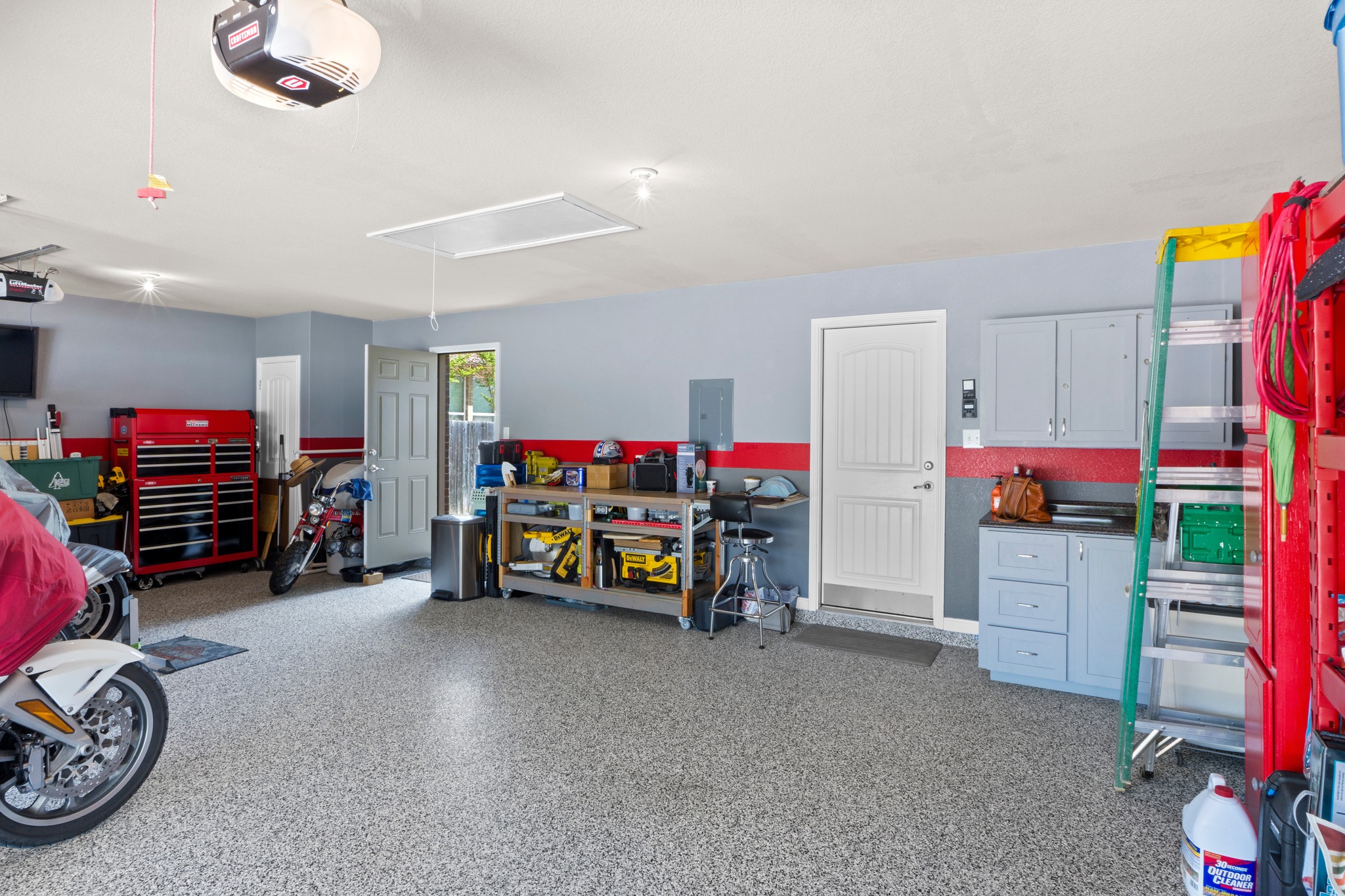 20525 Jackies Ranch Boulevard Pflugerville, TX 78660 - Photo 21 of 27 Insulated doors on this custom finished garage plus a door to the backyard