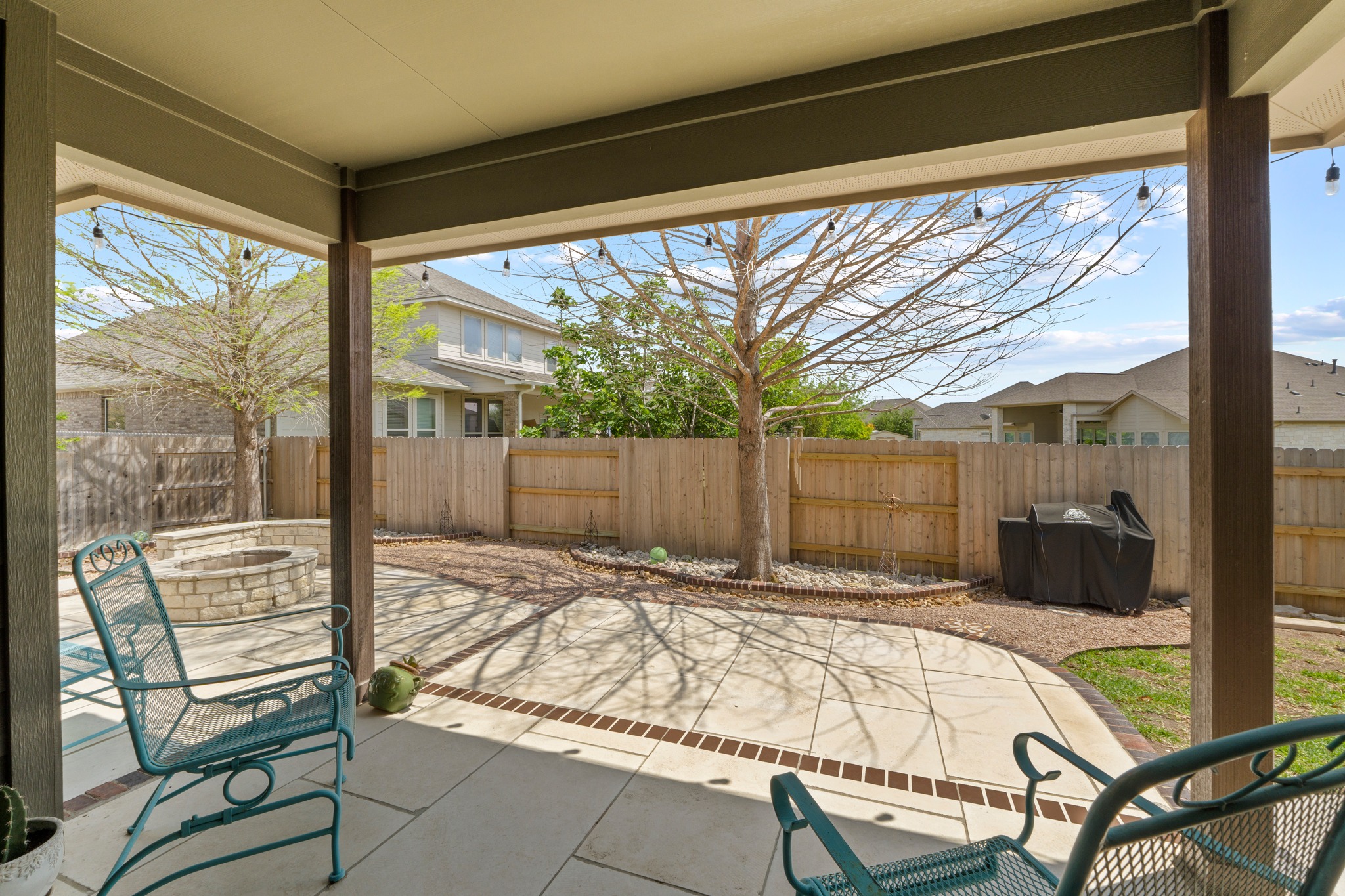 20525 Jackies Ranch Boulevard Pflugerville, TX 78660 - Photo 23 of 27 Fenced backyard with a patio area, an outdoor fire pit, and sitting area