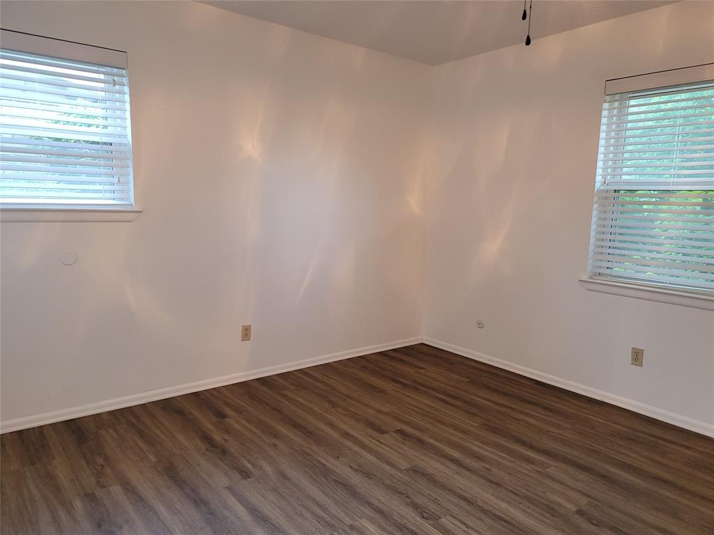 1000 Springdale Road Bedford, TX 76021 - Photo 14 of 36 Main bedroom windows. Blinds installed throughout the home!