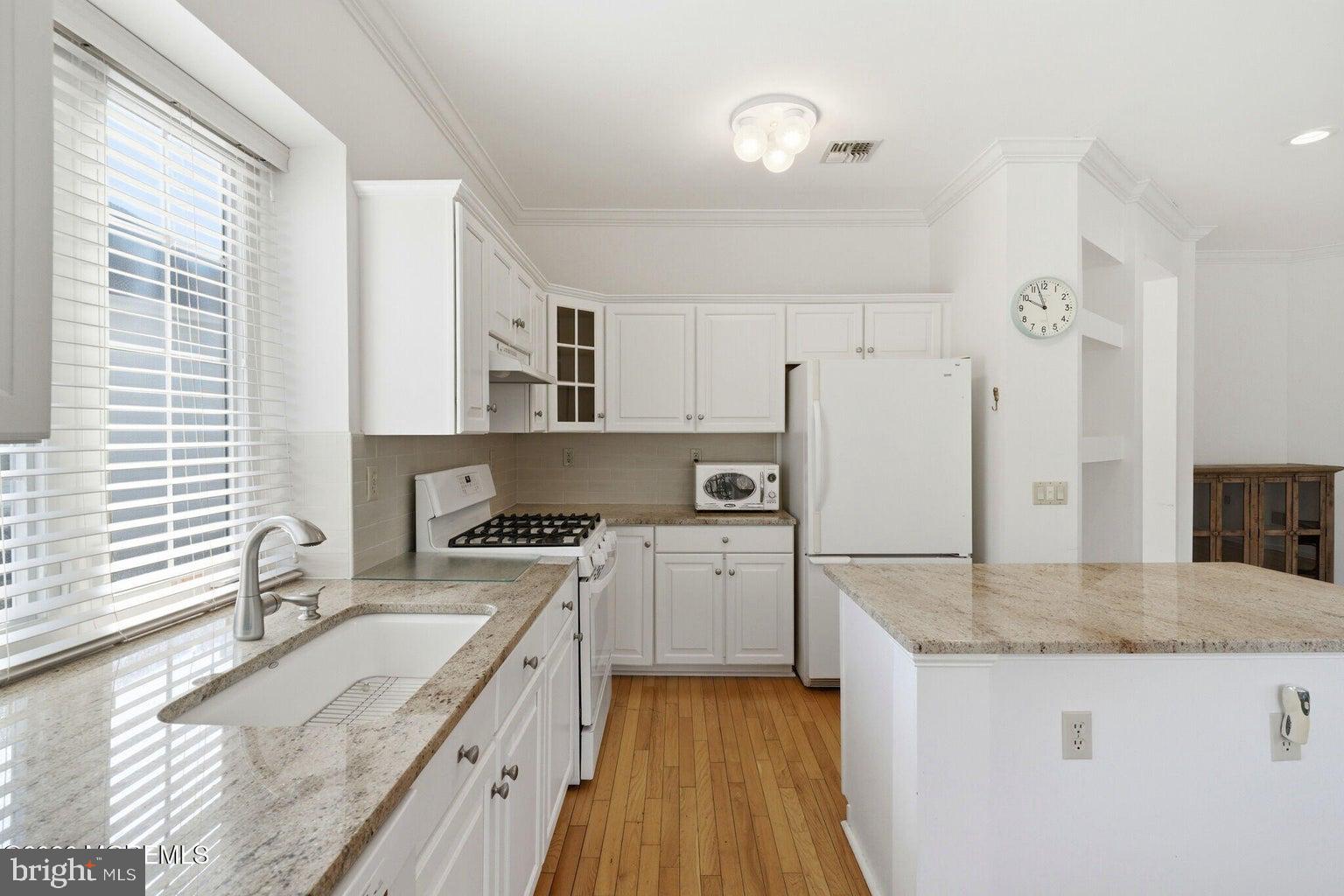 11 Ripple Terrace Barnegat, NJ 08005 - Photo 20 of 64 a kitchen with stainless steel appliances granite countertop a sink stove and refrigerator