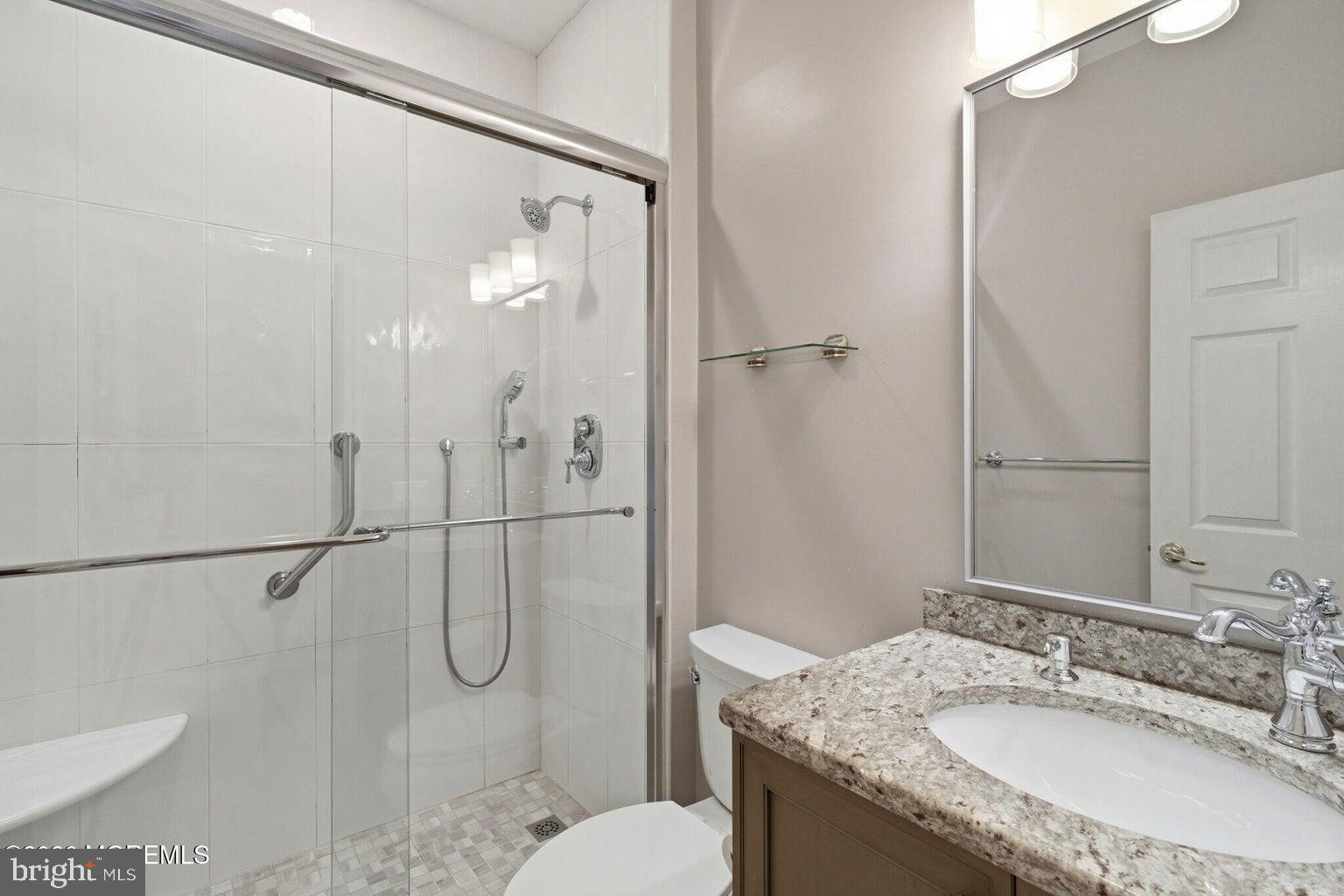 11 Ripple Terrace Barnegat, NJ 08005 - Photo 27 of 64 a bathroom with a granite countertop shower sink vanity and toilet