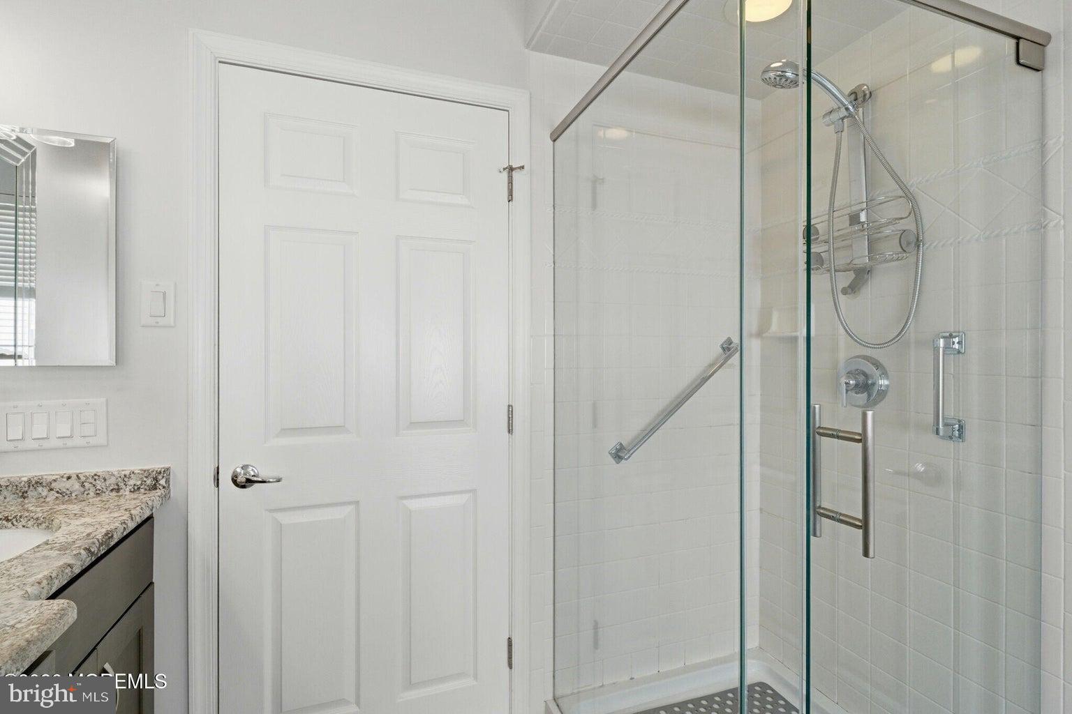 11 Ripple Terrace Barnegat, NJ 08005 - Photo 30 of 64 a bathroom with a granite countertop shower and a sink