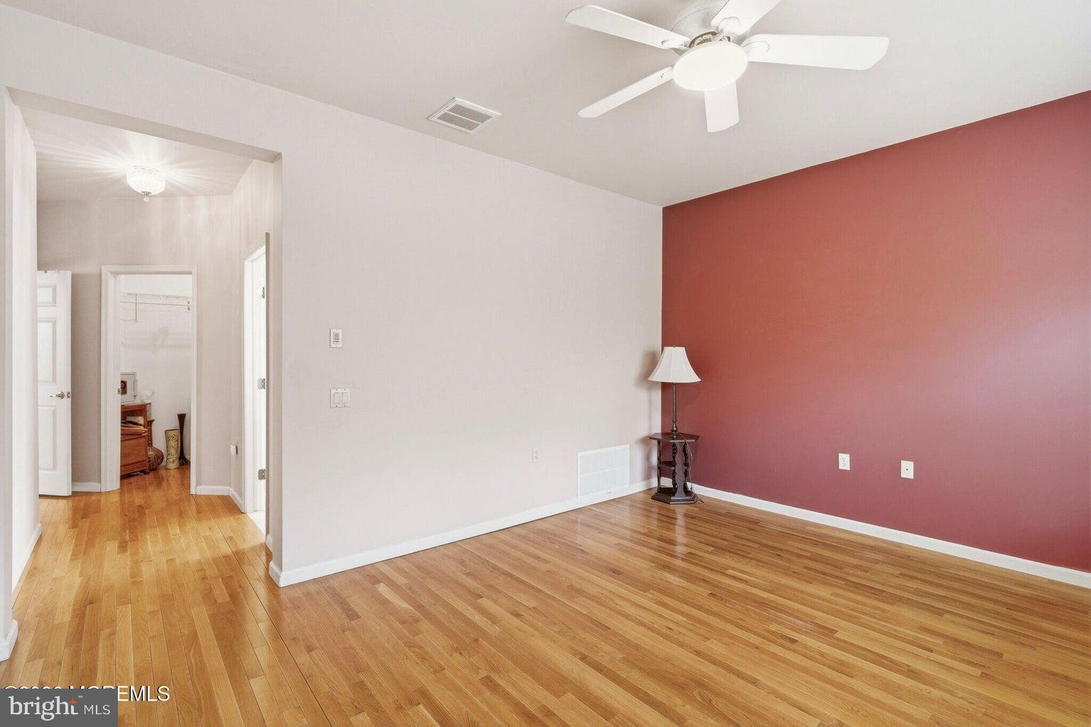 11 Ripple Terrace Barnegat, NJ 08005 - Photo 31 of 64 a view of empty room with wooden floor and fan
