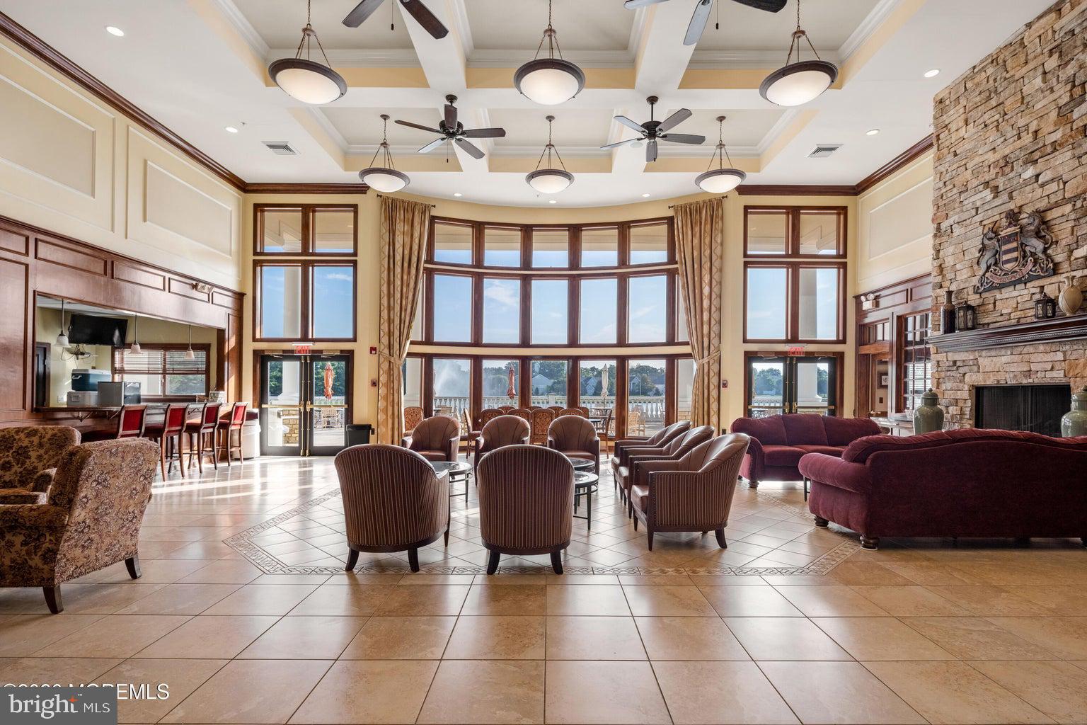 11 Ripple Terrace Barnegat, NJ 08005 - Photo 44 of 64 a living room with furniture a fireplace and a chandelier