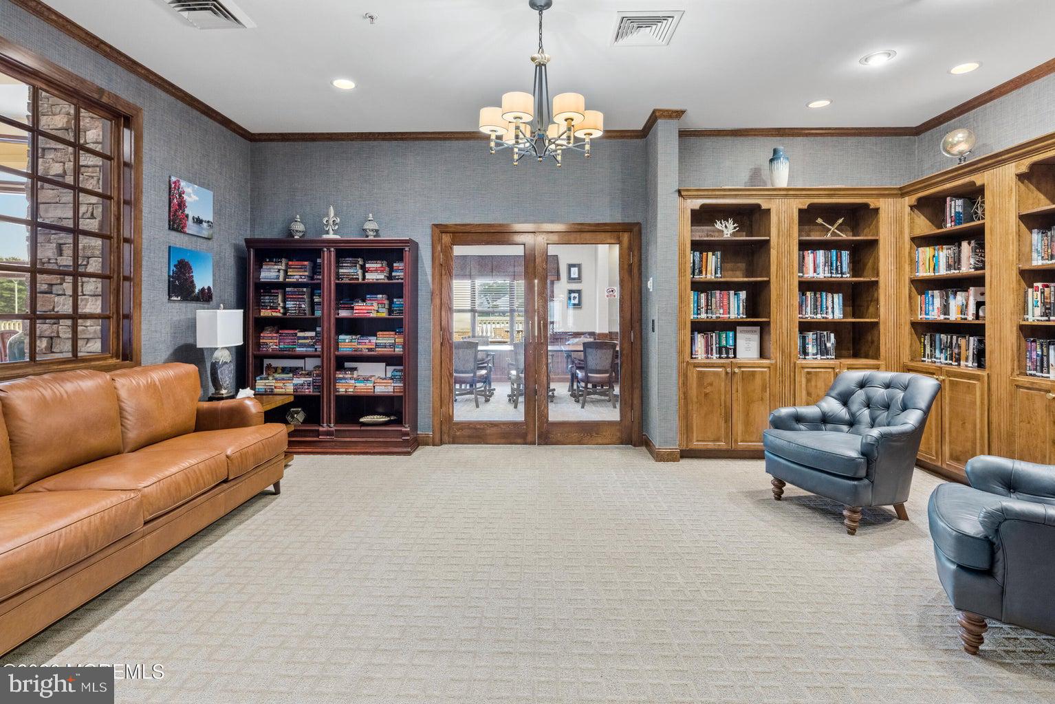 11 Ripple Terrace Barnegat, NJ 08005 - Photo 45 of 64 a living room with furniture and a chandelier