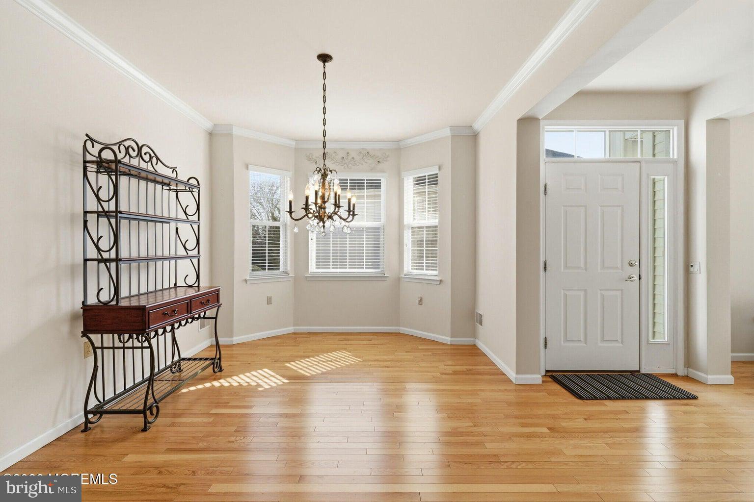 11 Ripple Terrace Barnegat, NJ 08005 - Photo 7 of 64 a view of an empty room with window and wooden floor