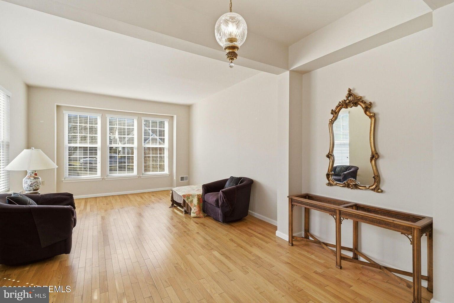 11 Ripple Terrace Barnegat, NJ 08005 - Photo 10 of 64 a view of a livingroom with furniture wooden floor and a window
