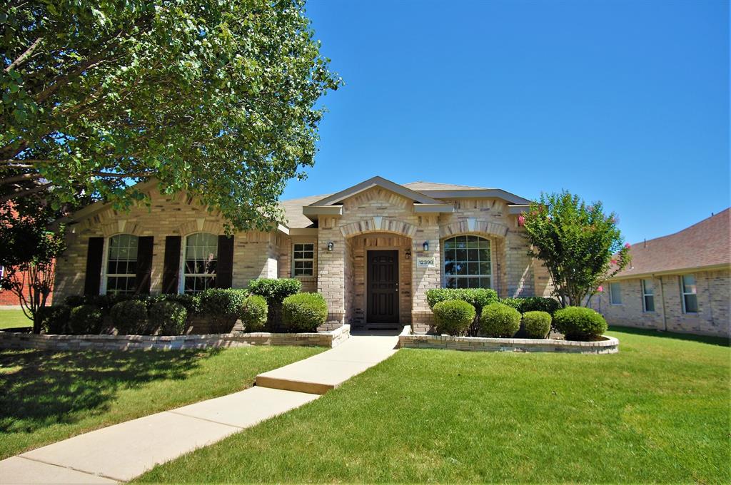 12398 Ridgetop Circle Frisco, TX 75035 - Photo 1 of 1 a front view of a house with garden