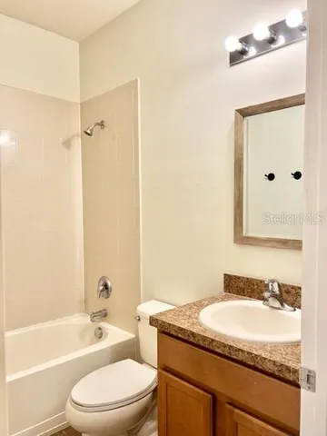 an empty room with a mirror