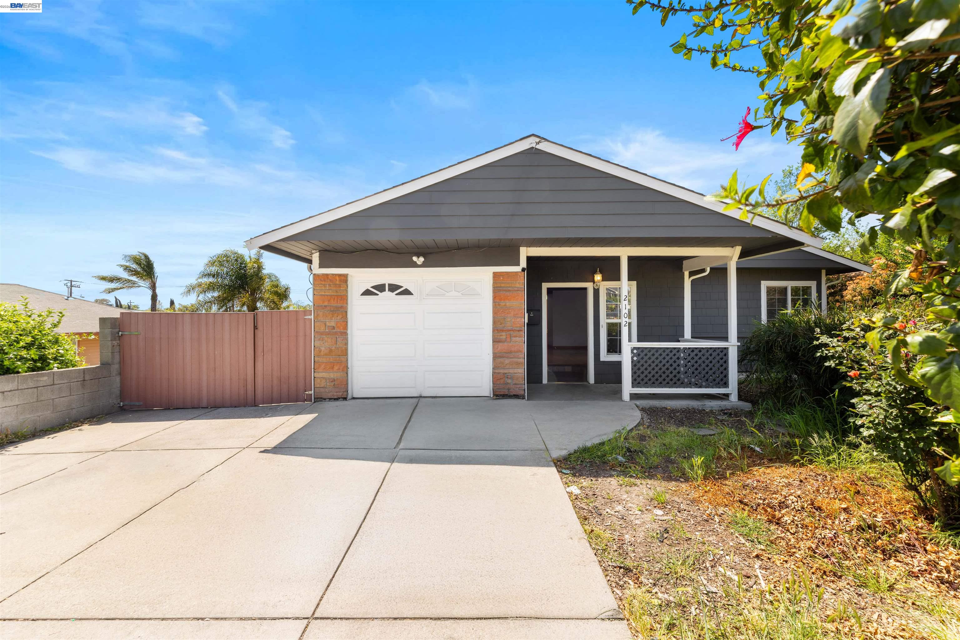 2102 Overhill Road Concord, CA 94520 - Photo 1 of 38 a front view of a house with a yard and garage