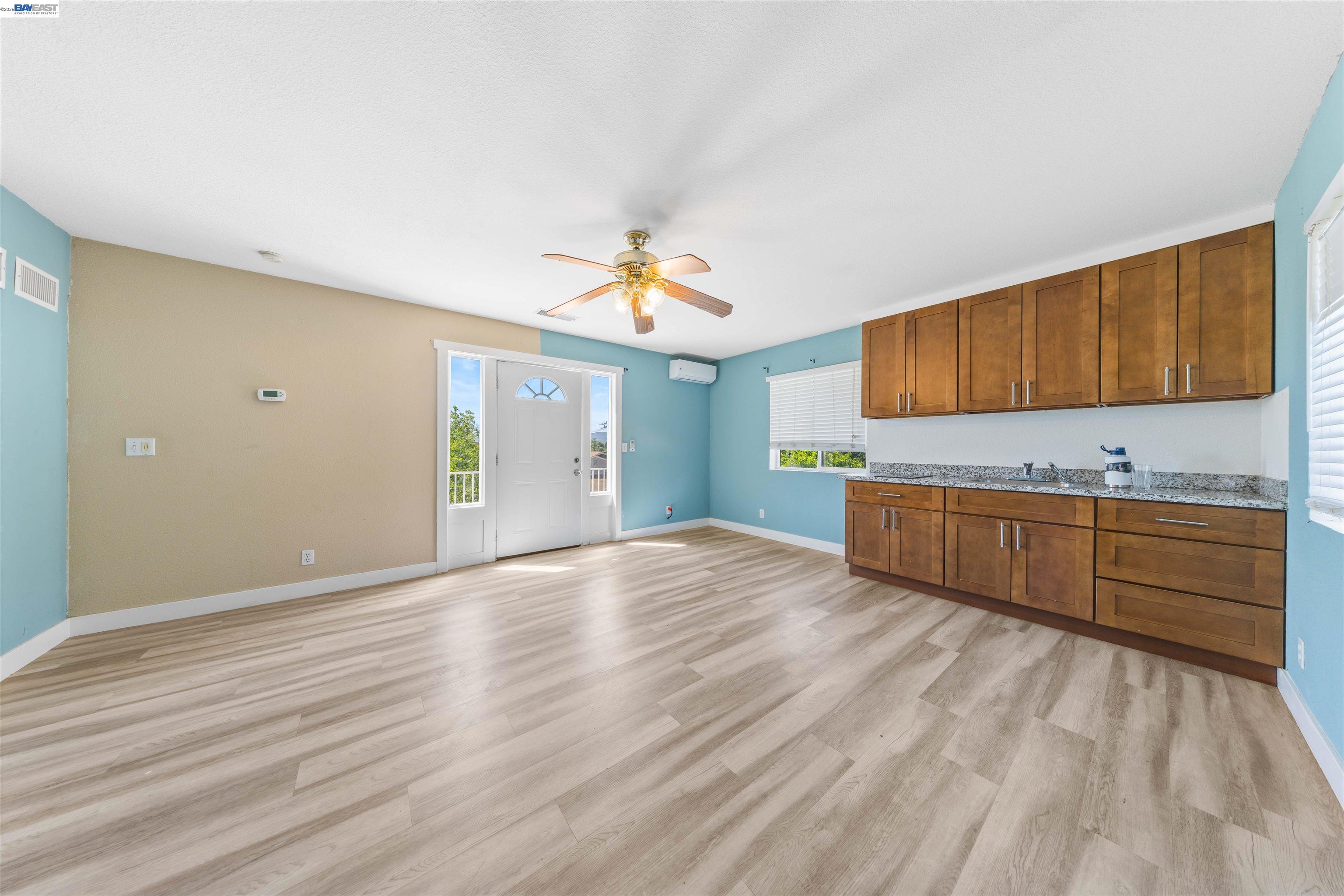 2102 Overhill Road Concord, CA 94520 - Photo 23 of 38 a kitchen with stainless steel appliances granite countertop a sink cabinets and wooden floor