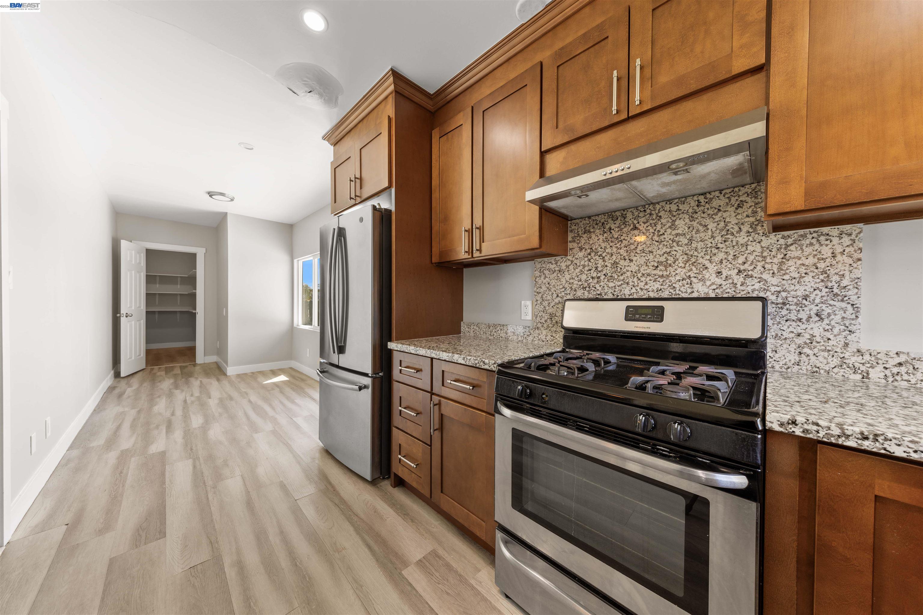 2102 Overhill Road Concord, CA 94520 - Photo 25 of 38 a kitchen with wooden floors and appliances