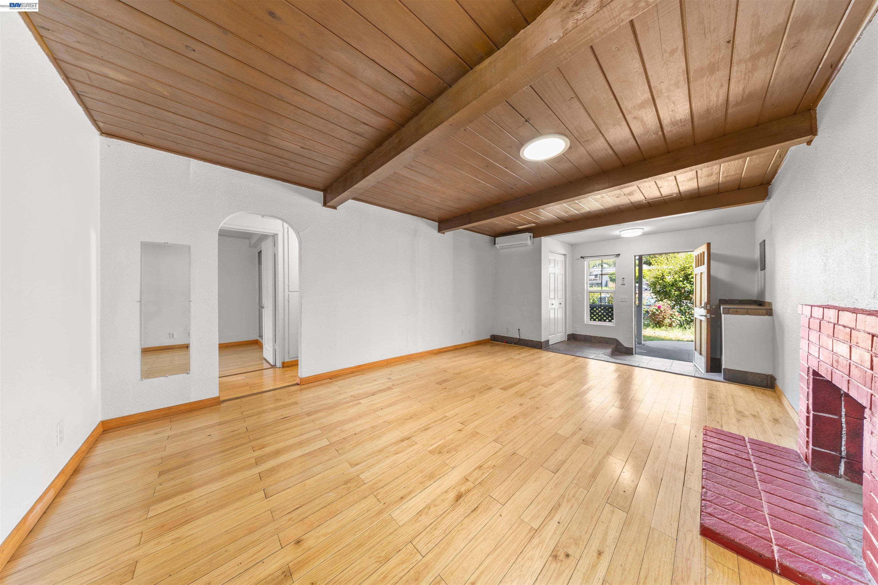 2102 Overhill Road Concord, CA 94520 - Photo 26 of 38 a view of an empty room with a window and wooden floor